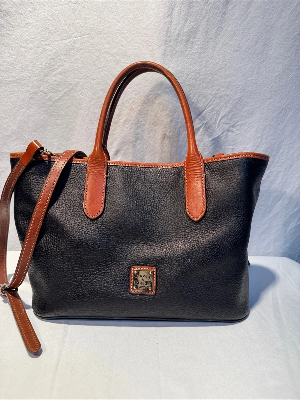 Dooney & Bourke Black Pebbled Leather Tote with Brown Trim & Handles